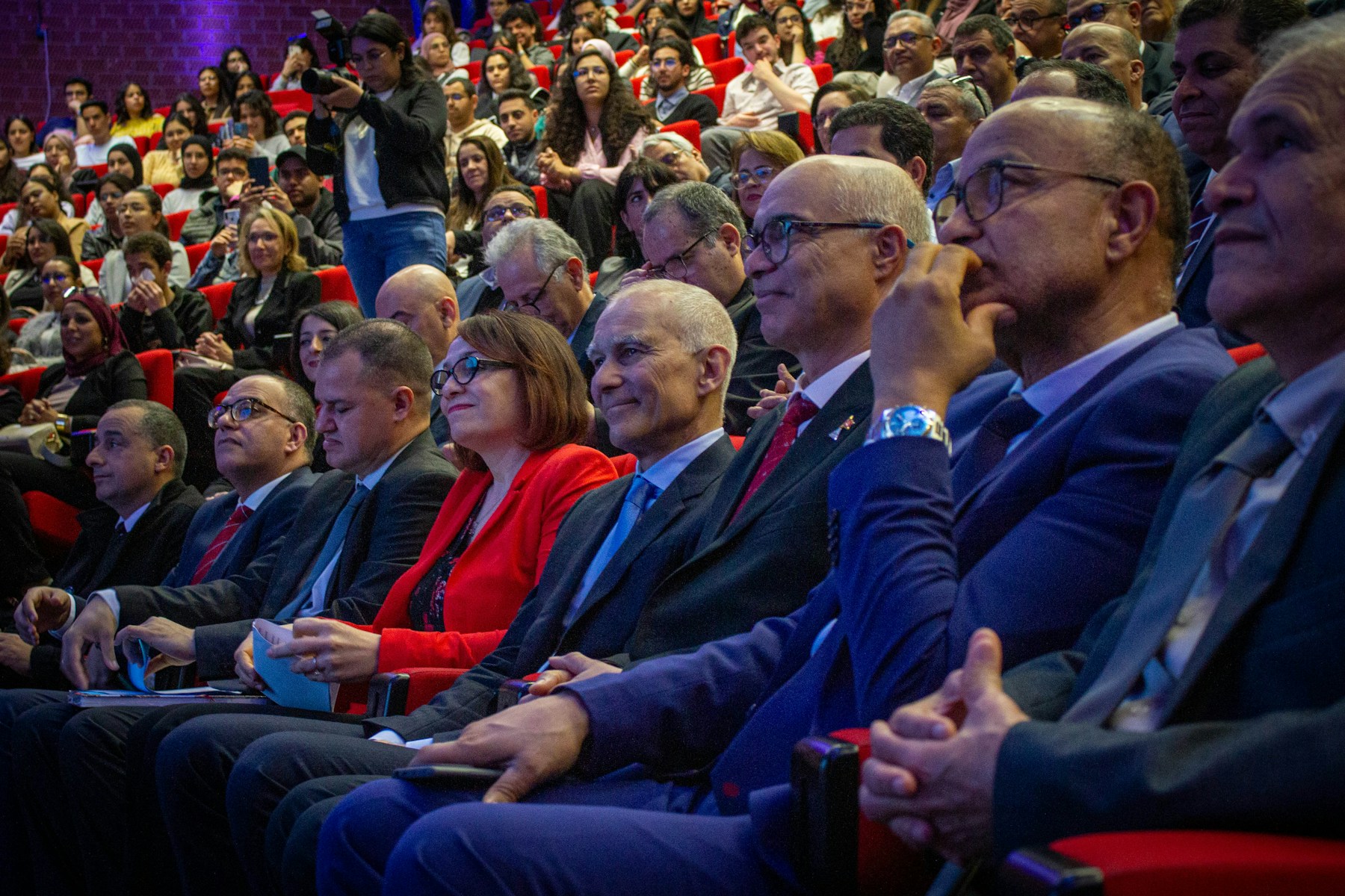 An audience watching a technology presentation